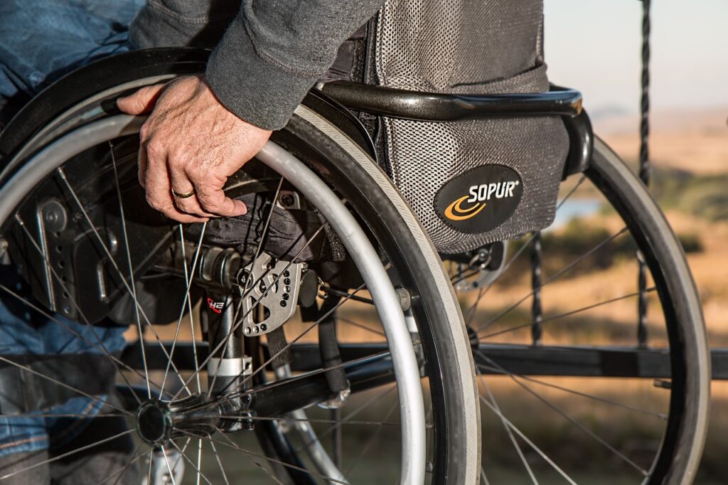 Person in a wheelchair after an accident — example of maximum medical improvement in Texas